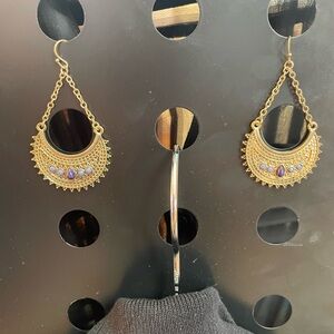 Dangling crescent earrings